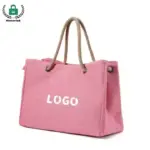 The Reusable Heavyweight Canvas Tote Bag features a pink design with rope handles and "LOGO" در جلو, و برای سفارشی سازی OEM و ODM در دسترس است.