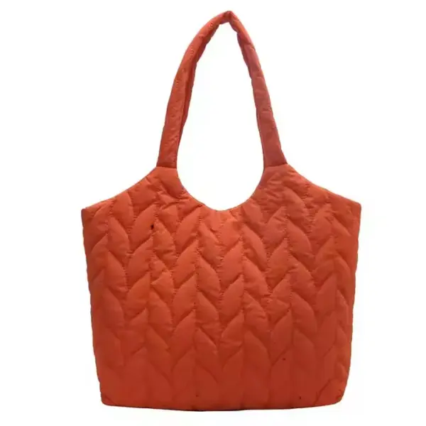Puffed Quilted Handbag for Women in orange with a round handle and chevron pattern, shown on a white background. OEM and ODM services offered for custom designs.