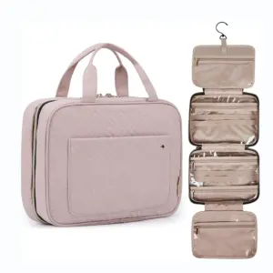 Light pink Waterproof Hanging Toiletry Makeup Bag with handles, unzipped to show multiple clear zippered compartments. OEM/ODM customization available.