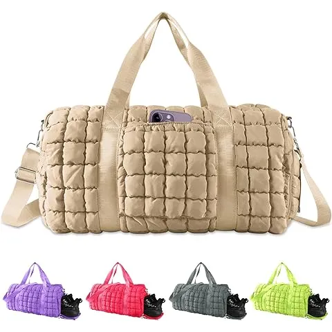 The Puffy Quilted Travel Tote is a duffel bag in beige with a front phone pocket, offered in five colors: purple, pink, red, gray, and yellow.