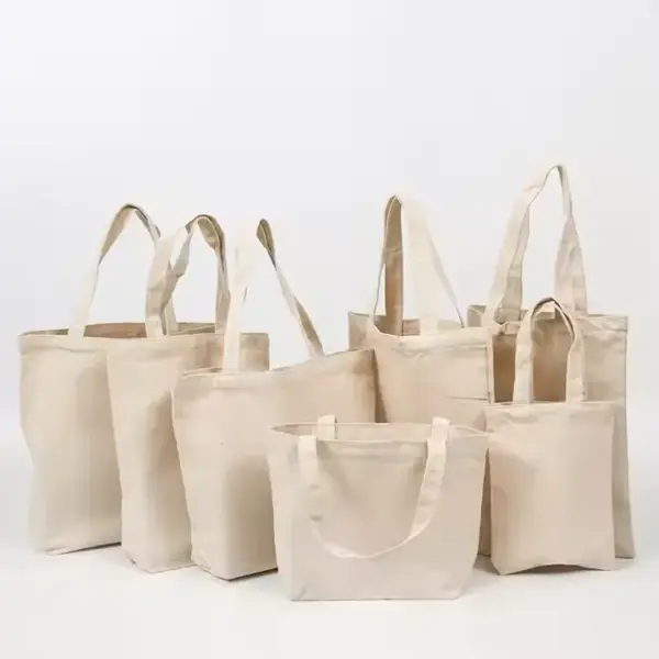 Six Custom Logo Canvas Tote Bags in assorted sizes, perfect for OEM ODM projects, displayed against a plain white background.