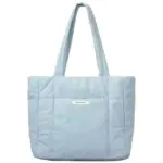 Μπλε φουσκωμένη τσάντα για γυναίκες με μεγάλες λαβές και μικρή λευκή ετικέτα μπροστά, Διατίθεται για προσαρμογή OEM και ODM.