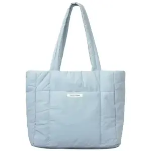 Blue Puffed Casual Handbag for Women with long handles and a small white front label, available for OEM and ODM customization.