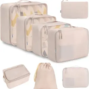 The Business Travel Waterproof Storage Set in beige features OEM ODM packing cubes and bags of various sizes, arranged neatly on a white background.