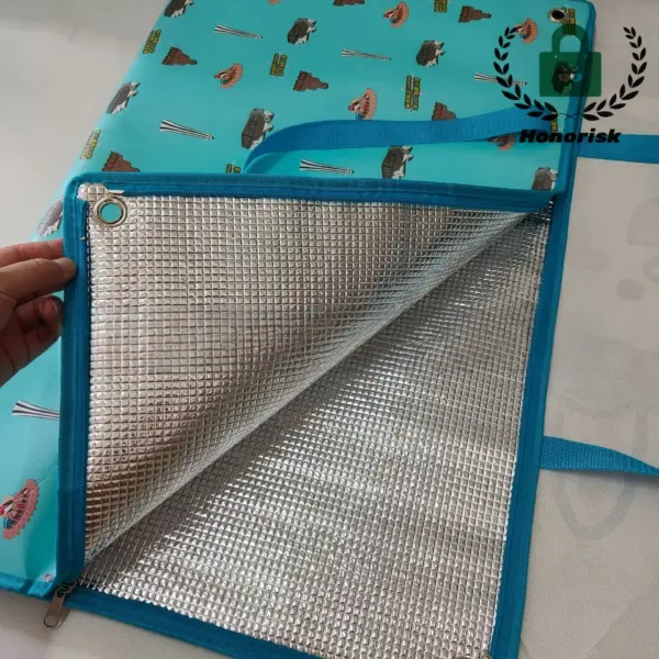 Open foldable waterproof picnic bag with buckle closure, blue edge, silver lining, and fun food-themed pattern—ideal for OEM and ODM customization.