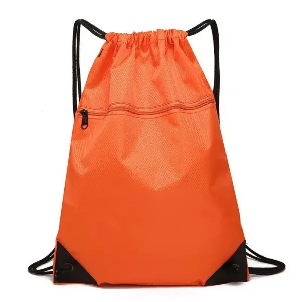 The Basketball Court Waterproof Polyester Drawstring Backpack comes in bright orange with a small zipper pocket and sturdy black straps.