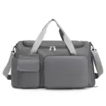 Minimalistický cestovní tote s velkou kapacitou je šedá taška na duffel se světle šedými rukojeti, přední kapsy, Nastavitelný ramenní popruh, a podporuje přizpůsobení ODM/OEM.