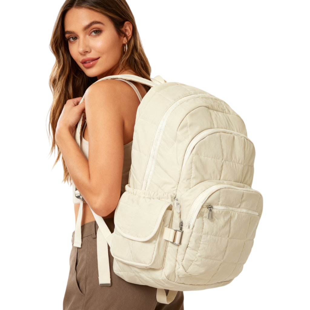 Person wearing the beige quilted backpack in a casual urban setting.